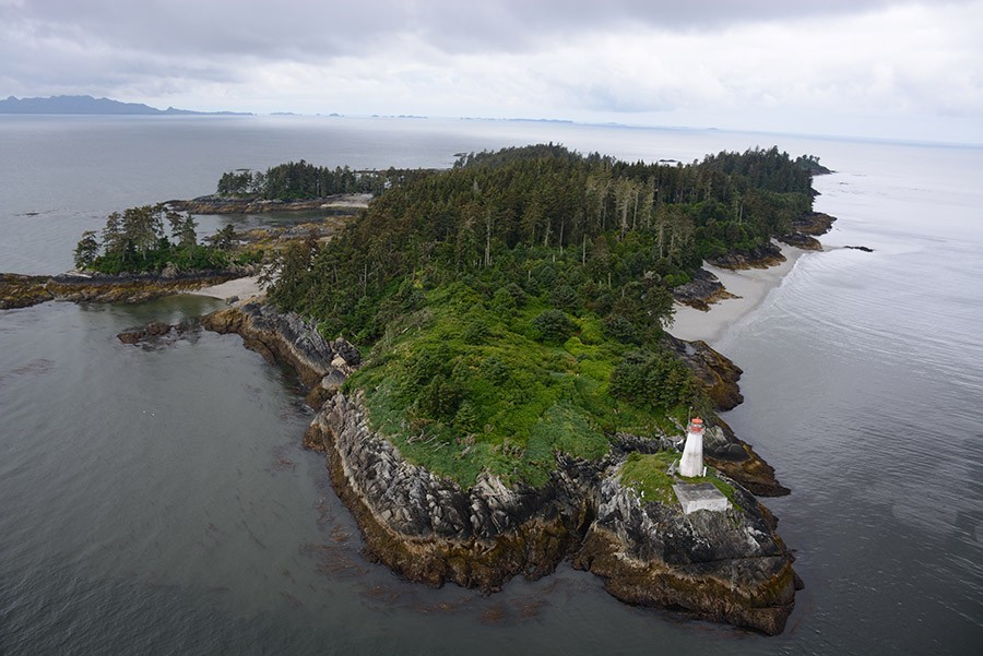 Aerial photo of island with lighthouse